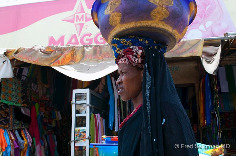 20090528_141305 D300 (1) P1 P1.jpg - Woman carry large bowl on head.  'Just something that is learned when young, especially by woman', said our guide